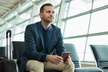 Image showing Airport, passport and business man for travel opportunity, immigration and relax in lobby waiting room for flight. Person or international entrepreneur with identity document and luggage or suitcase