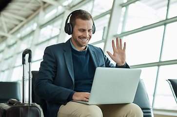 Image showing Computer call, wave and business man at an airport in a online meeting ready for work travel. Consulting, businessman and web worker traveling for a job interview talking on a digital conference