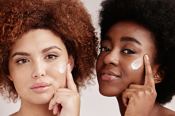 Image showing Skincare, face cream and portrait of women in a studio for a wellness, health and natural routine. Beauty, cosmetic and interracial females with facial moisturizer, spf or lotion by nude background.