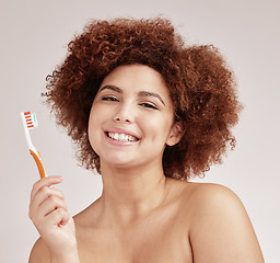 Image showing Black woman, toothbrush and studio portrait for mouth health, cleaning and hygiene by background. Happy gen z model, brushing teeth and smile for beauty, wellness or self care with dental toothpaste