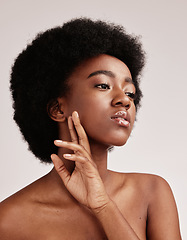 Image showing Beauty, skincare and face of a black woman in studio with dermatology, makeup and cosmetics. Aesthetic model on studio background for hair, self love and facial skin natural glow for spa wellness