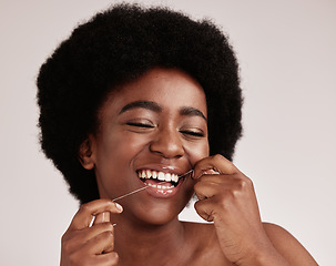 Image showing Black woman, skincare or dental floss for teeth grooming, healthcare wellness hygiene or gum disease prevention. Smile, happy or flossing beauty model with afro hair, mouth cleaning or tooth product