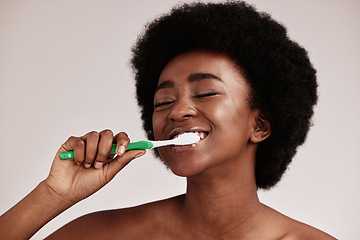 Image showing Toothbrush, brushing teeth and black woman for clean and healthy mouth on studio background. Face of person advertising dentist tips for dental care, whitening and cleaning with a hygiene smile