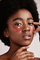 Image showing Skincare, eye or face mask portrait of black woman in studio with dermatology cosmetic product. Aesthetic model with hand on spa collagen beauty patch for health, wellness and natural facial glow