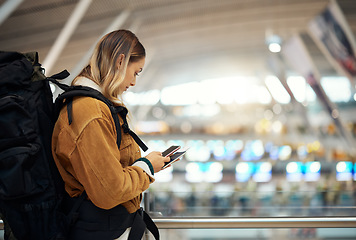 Image showing Passport, travel and woman with phone at airport lobby for.social media, internet browsing or web scrolling. Vacation, mobile technology and female with smartphone and ticket for global traveling.