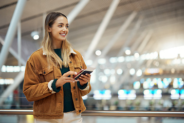 Image showing Travel, phone and woman with passport at airport lobby for.social media, internet browsing or web scrolling. Vacation, thinking and happy female with mobile smartphone and ticket for global journey.