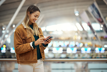 Image showing Phone, travel and woman with passport at airport lobby for.social media, internet browsing or web scrolling. Vacation, mobile technology and female with smartphone and ticket for global traveling.