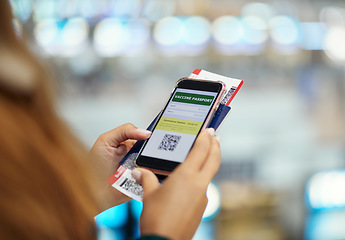 Image showing Hands, phone travel and vaccine passport app for vacation, holiday or global traveling. Covid, mobile and woman with smartphone with digital software for barcode boarding pass or ticket at airport.