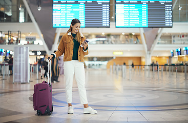 Image showing Travel, woman in airport and luggage for vacation, break and girl excited, smile and check boarding ticket. Female, lady and traveler with suitcase, international and departure with passport and trip