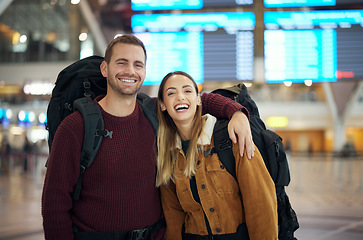 Image showing Couple, love and travel portrait at airport lobby for holiday, vacation or global traveling. Luggage, valentines day and happy man and woman laughing at funny joke, hug or waiting for flight together