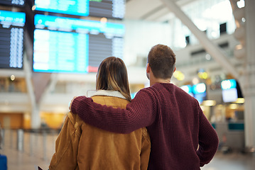 Image showing Couple at airport, travel and flight time for vacation overseas,.adventure and love with romantic getaway and back view. Man, woman with international holiday and ready to board airplane for flight