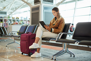 Image showing Travel, tablet and woman relax in airport lobby, social media or internet browsing. Immigration, technology and female with touchscreen for networking, web scrolling and waiting for flight departure.