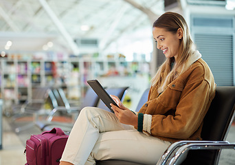 Image showing Tablet, travel and woman relax in airport lobby, social media or internet browsing. Immigration, technology and female with touchscreen for networking, web scrolling and waiting for flight departure.