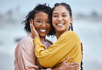 Image showing Lesbian, hug and portrait of couple of friends for lgbtq or queer love and freedom on vacation together at the beach. Black woman and partner on a date, fun and excited for valentines holiday by sea