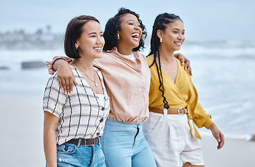 Image showing Beach, diversity and friends, hug and walk while laughing, relax and talking against nature background. Travel, women and group embrace while walking at the sea, happy and smile on ocean trip in Bali