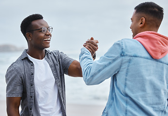 Image showing Friends, handshake and greet at a beach while on vacation, holiday or trip, happy and excited on mockup background. Men, shaking hands and people smile and reunion at the sea on ocean trip in Bali