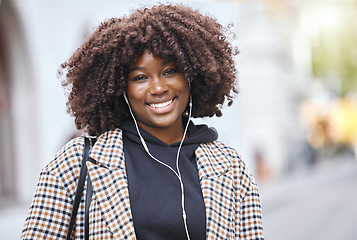 Image showing Black woman, portrait and smile with earphones in city, urban town and Kenya. Happy plus size african female listening to music, radio and audio podcast with natural afro, happiness and relax outdoor