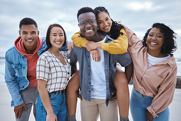 Image showing Friends, group and portrait at beach, ocean and outdoor nature for fun, happiness and travel. Diversity of happy young people at sea for holiday, vacation and smile for relaxing weekend trip together