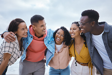 Image showing Diversity, hug and friends at a beach, happy and smile while bonding in nature on mockup background. Embrace, men and women outdoor for travel, reunion or weekend trip, joy or cheerful on copy space