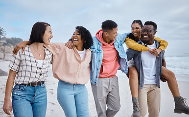 Image showing Friends, group and smile at beach, ocean and outdoor nature for fun, happiness and travel. Diversity of happy young people at sea for holiday, vacation and social gathering, weekend or relax together