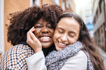 Image showing Women, friends and hug on street in city with smile, happiness and solidarity by blurred background. Young african lesbian, happy couple and embrace with love, romance and valentines day adventure