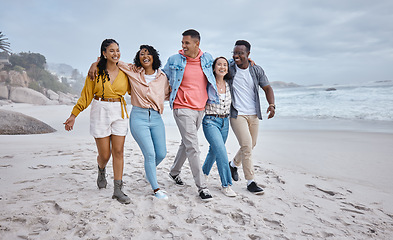 Image showing Happy, diversity and friends walking at the beach for holiday, vacation and people bonding on travel. Men, smile and women group relax at the sea, laugh and cheerful on an ocean trip in Miami