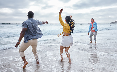 Image showing Dance, water or crazy friends at a beach to relax on holiday vacation bonding in nature together in Bali. Funny, excited men and happy women group dancing at sea enjoy traveling on ocean trips