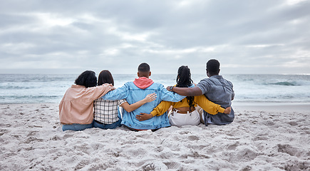 Image showing Diversity, hug or friends on beach sand to relax on calm holiday, vacation bonding in nature together. Back view, men and women group relaxing at sea enjoy traveling on ocean trips in Miami, Florida