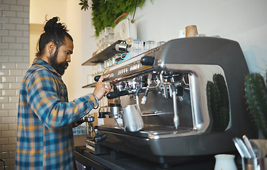 Image showing Cafe, startup and service with a man barista behind the counter to prepare a drink. Coffee shop, kitchen and waiter with a male working in a restaurant as an entrepreneur or small business owner