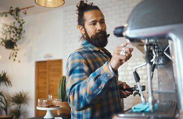 Image showing Man in cafe, barista work machine and create drink with focus and small business, workflow and process. Espresso, latte or cappuccino production, busy server in coffee shop and professional