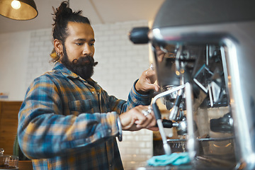 Image showing Man in coffee shop, barista working machine and create drink with focus and small business, workflow and process. Espresso, latte or cappuccino production, busy server in cafe and professional