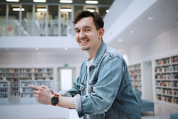 Image showing Portrait, university or man with phone in library for research, communication or blog news. Books, education or student smile on smartphone for scholarship networking, social media or online content