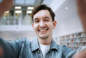 Image showing Education, selfie and man in library, smile and cheerful for knowledge, learning and on break. Portrait, male student and academic on campus, casual and happiness for results, achievement and relax