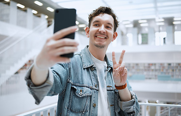 Image showing Library, selfie and university man with peace sign for lifestyle update, social media or blog post with happy education. Research, study and phd student or person with emoji sign for profile picture