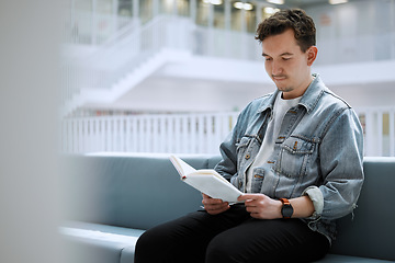 Image showing Reading, books and relax man in library for university, college or research focus with philosophy scholarship. Student person of English language, education or knowledge on history studying on campus