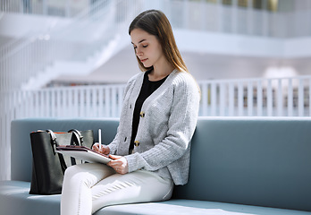 Image showing University, student or woman in library with tablet for research, education or learning. Thinking, digital or girl on tech for scholarship study, search or planning school project at collage campus