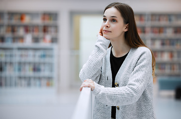 Image showing Thinking, vision and student in library for knowledge, learning and academic research in building. Education, university and young woman with ideas, success mindset and thoughtful for college goals