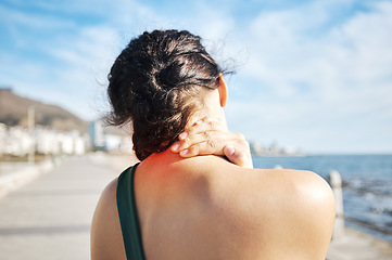 Image showing Fitness, beach or sports woman with neck pain after exercising, body training injury or outdoor workout. Red glow, back view or injured girl runner suffering from muscle tendon after running exercise