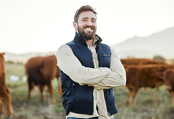 Image showing Small business, farming and portrait of man with cows in field, happy farm life in countryside in dairy and beef production. Nature, farmer and sustainability and confidence in agriculture and food.