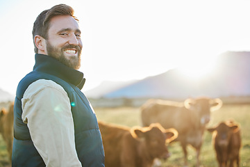 Image showing Sustainability, cows and portrait of farmer with smile on field, happy farm in countryside with dairy and beef production. Nature, meat and milk farming, sustainable business in agriculture and food.