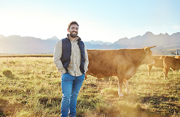 Image showing Sustainability, farming and portrait of farmer with cows on field, happy man in countryside with dairy and beef production. Nature, meat and milk farm, sustainable business in agriculture and food.