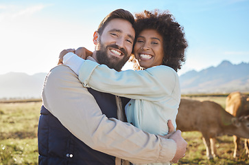 Image showing Love, cow and smile with interracial couple on farm for agriculture, peace and growth. Teamwork, animals and hug with portrait of man and black woman in field for sustainability, agro or environment