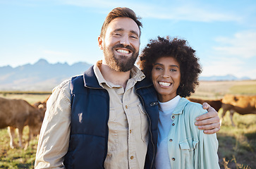 Image showing Love, cow and portrait of interracial couple on farm for agriculture, livestock and growth. Teamwork, cattle and hug with man and black woman in grass field for sustainability, health or environment