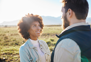 Image showing Nature, smile and love with interracial couple on farm for agriculture, peace and growth. Teamwork, bonding and hug with man and black woman in grass field for sustainability, health and environment