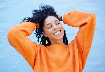 Image showing Happy, fashion and face of black woman on blue background with smile, confident mindset and freedom. Happiness, beauty and girl relax in city with urban style, trendy and stylish clothes on weekend