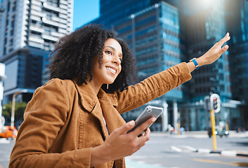 Image showing Black woman, city and stop taxi with hand, phone and sunshine on urban adventure in summer. Girl, outdoor on sidewalk or street in metro for transport, bus or ride service with app, holiday or travel