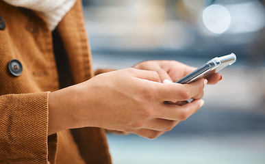 Image showing Hands, phone and woman in city typing on social network, internet search and gps navigation for travel. Urban app, closeup and mobile technology, smartphone and online connection of web notification