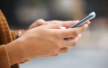 Image showing Hands, cellphone and woman in city typing on social network, internet search and mobile gps for travel. Urban app, closeup and smartphone technology for 5g online connection, web post or notification