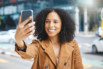 Image showing Selfie, travel and black woman in a city, happy and smile on vacation against urban background. Blog, social media and girl influencer live streaming trip in New York for online, followers or network