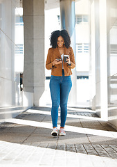 Image showing Black woman, phone or walking with coffee in city, town or urban street in morning commute, travel or office lunch break. Smile, happy or creative worker on mobile communication technology with tea